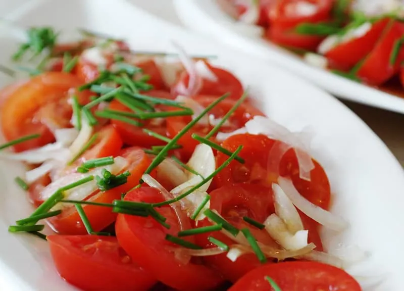 Tomato salad with onions and herbs