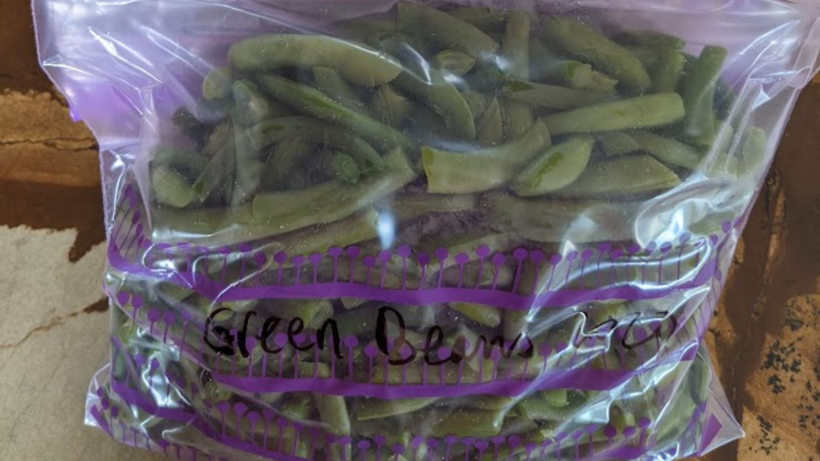 a bag of green beans ready to go in the freezer. 