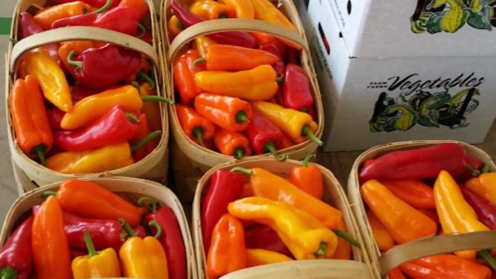 Bulk red and orange peppers.