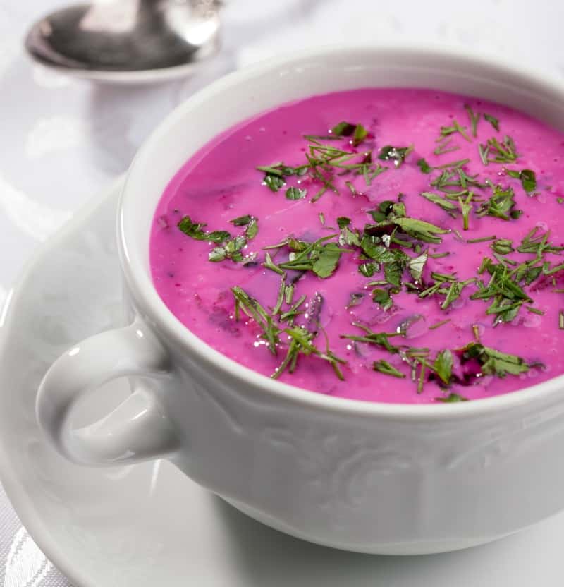 Cold beet soup in a white bowl