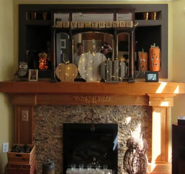 Harvest mantle - decorated with rustic pumpkins make of recycled wood