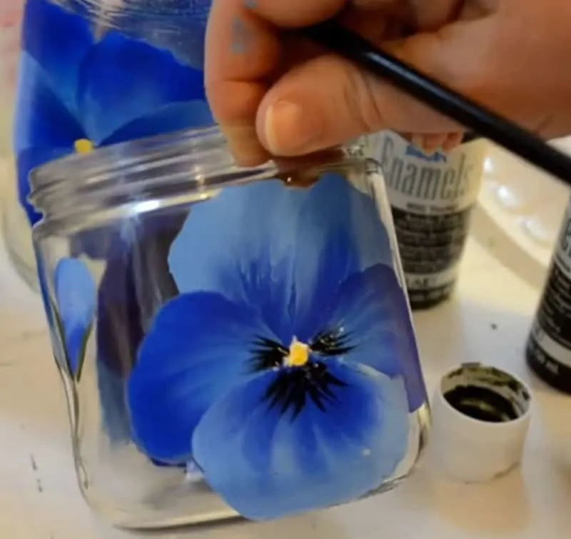 Painted pansies on glass jar
