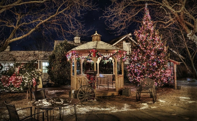 Lit up wooden gazebo in winter