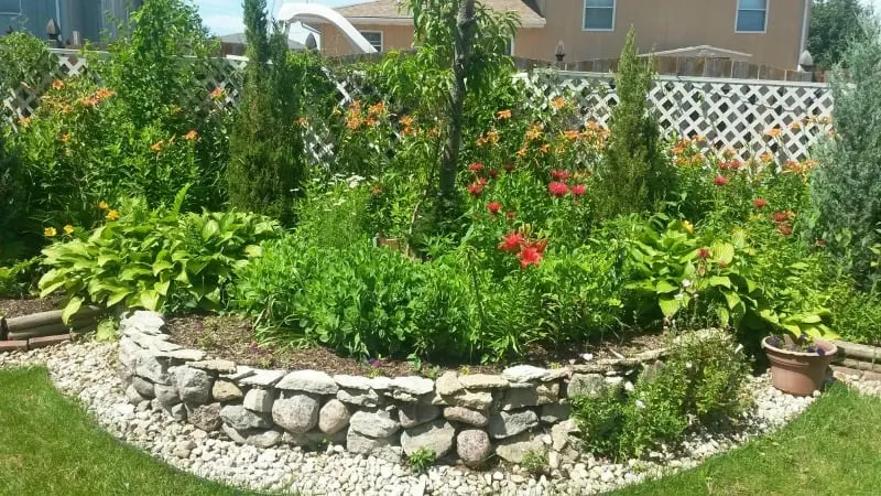 Beautiful circular rock wall with flowers