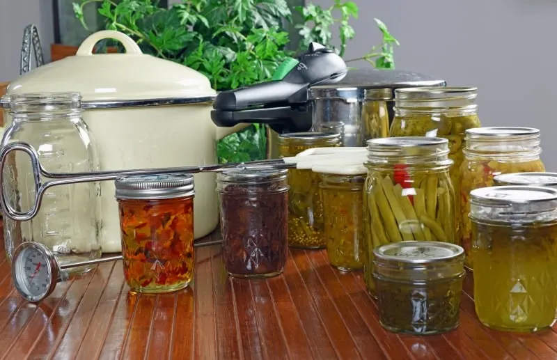 Canned goods with pressure canner in the background