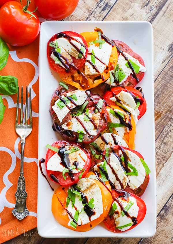 Tomato Caprese on a rectangular white plate