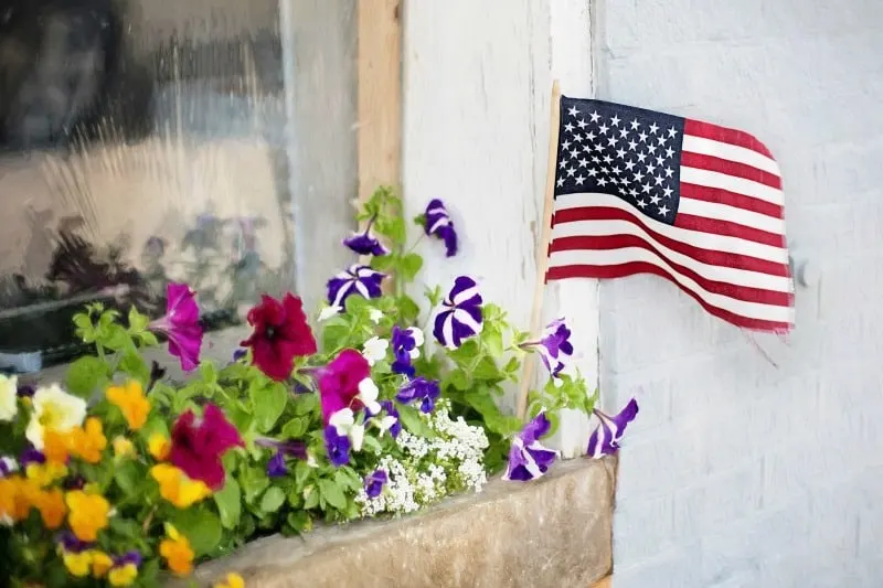 Fourth of July flowers and American flag