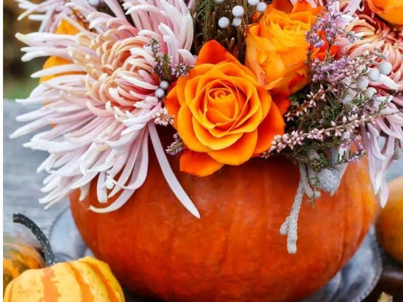 Fall flower bouquet arranged in a pumpkin