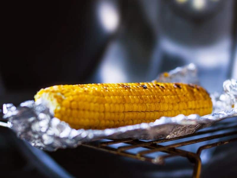 Baked corn in foil on the grill