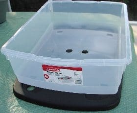 Rubbermaid container wiht holes, ready for creating a mini flow and drain system