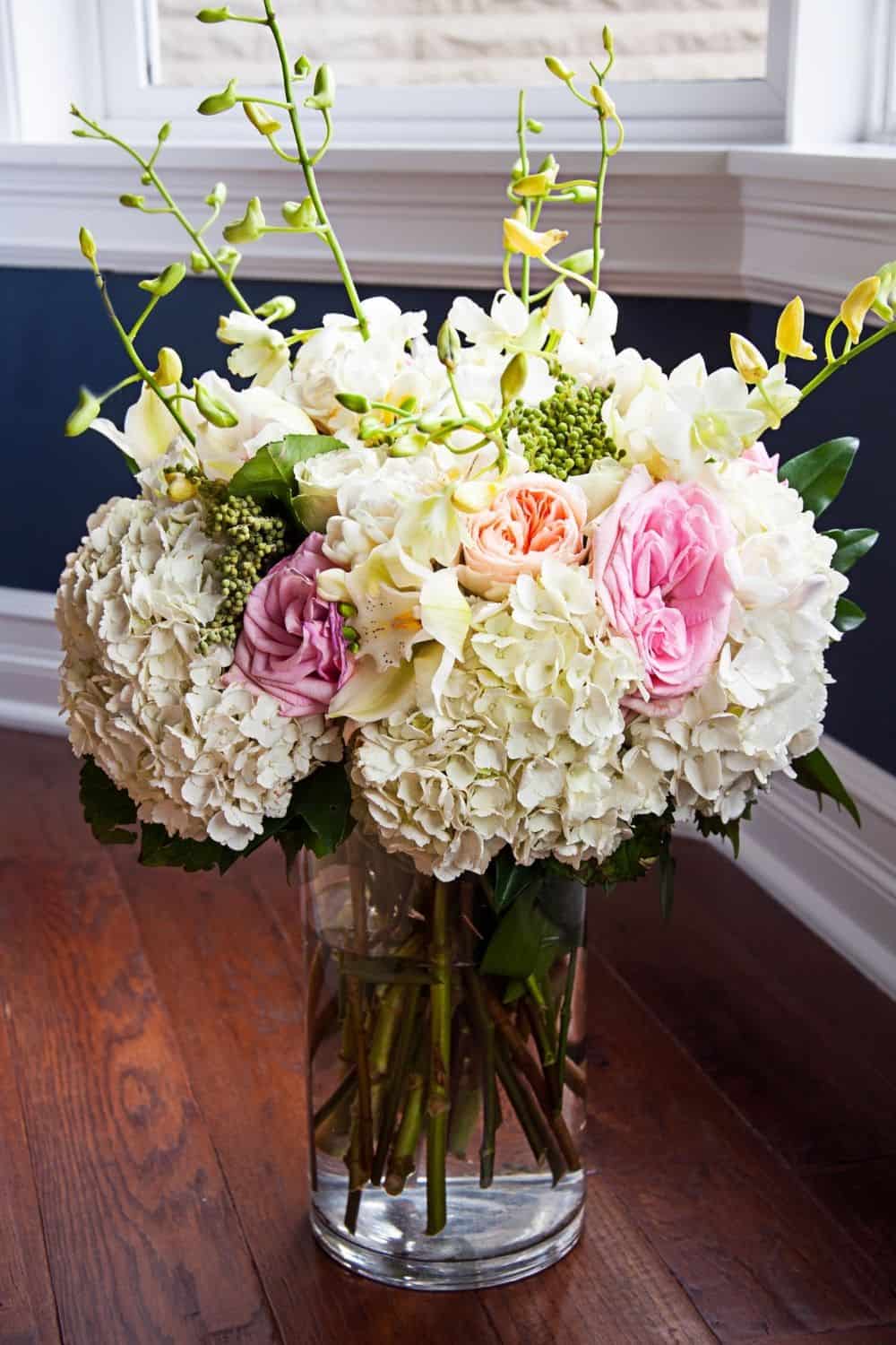 bridal bouquet featuring white hydrangeas and pink roses