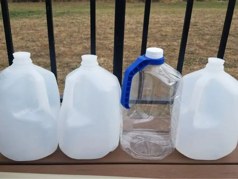 empty water jugs ready for winter sowing