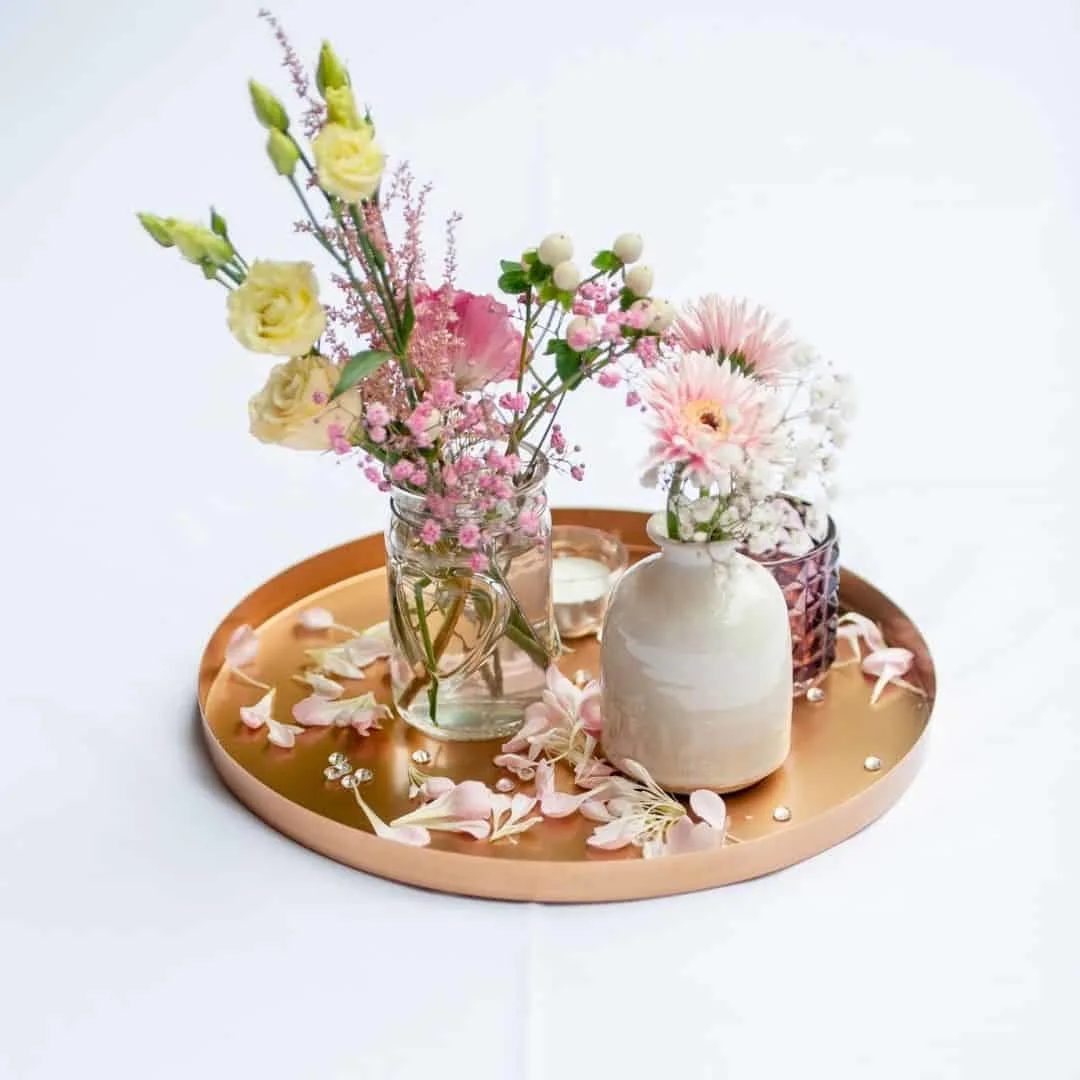 spring flowers beautifully arranged on a wooden tray