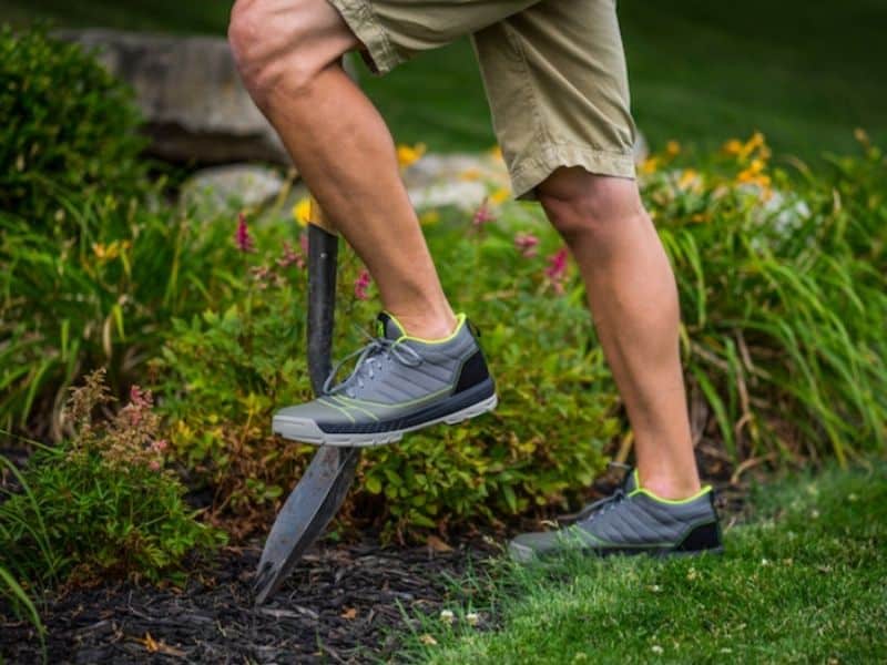 man wearing Kujo shoes diggning in the garden