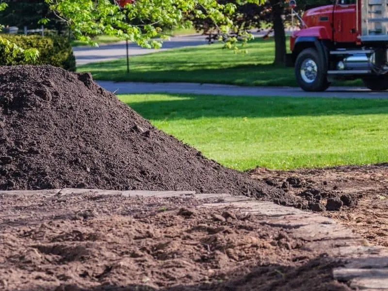 a pile of topsoil in the front yard