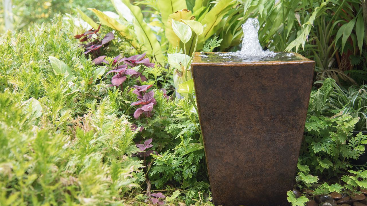 water feature in garden is Chinese belief fountain from pot put on right front of house is lucky