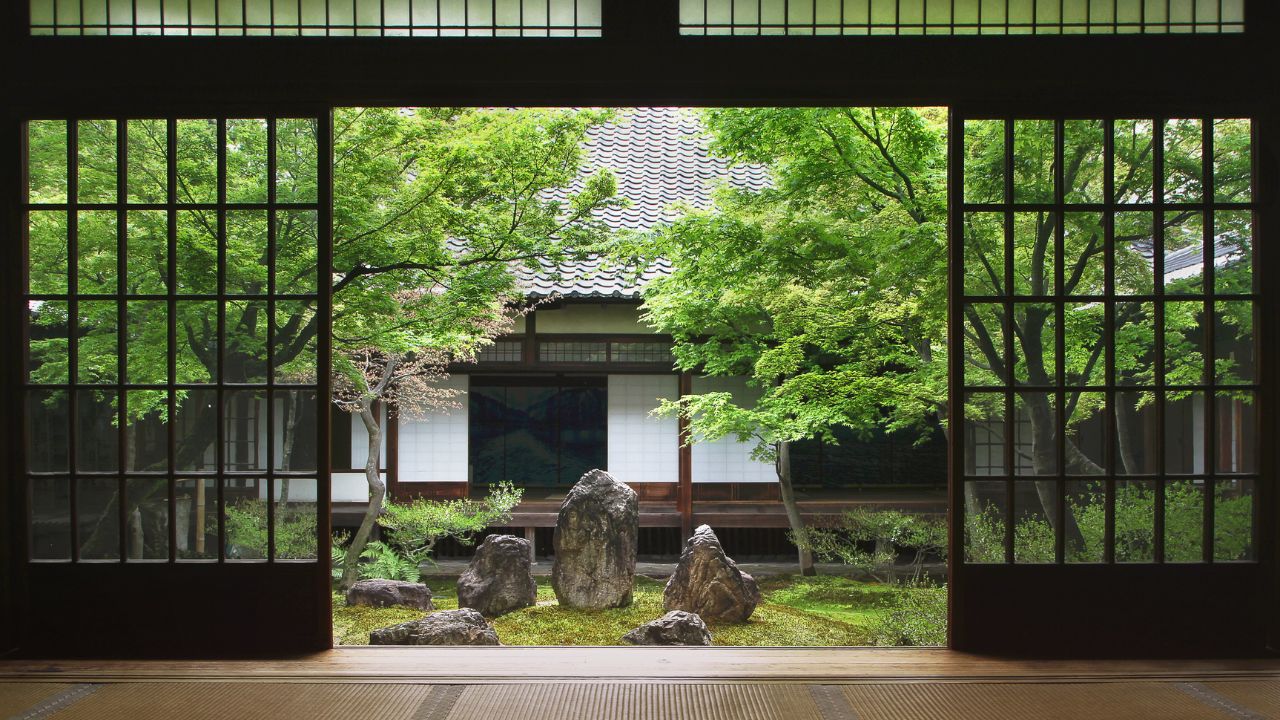 View from inside on japanese garden in Kyoto. Terrace. Stone, rock, boulder as focal point in garden, yard, terrace