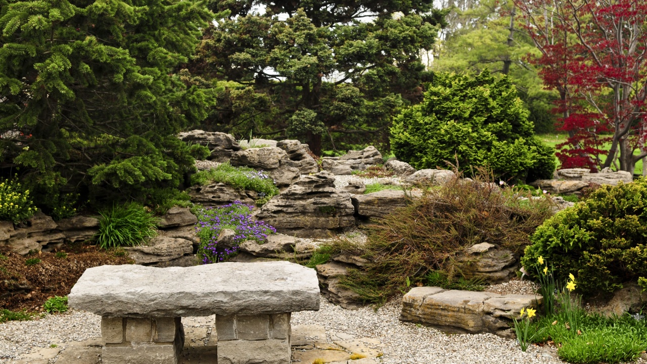 Japanese zen garden with natural stone bench