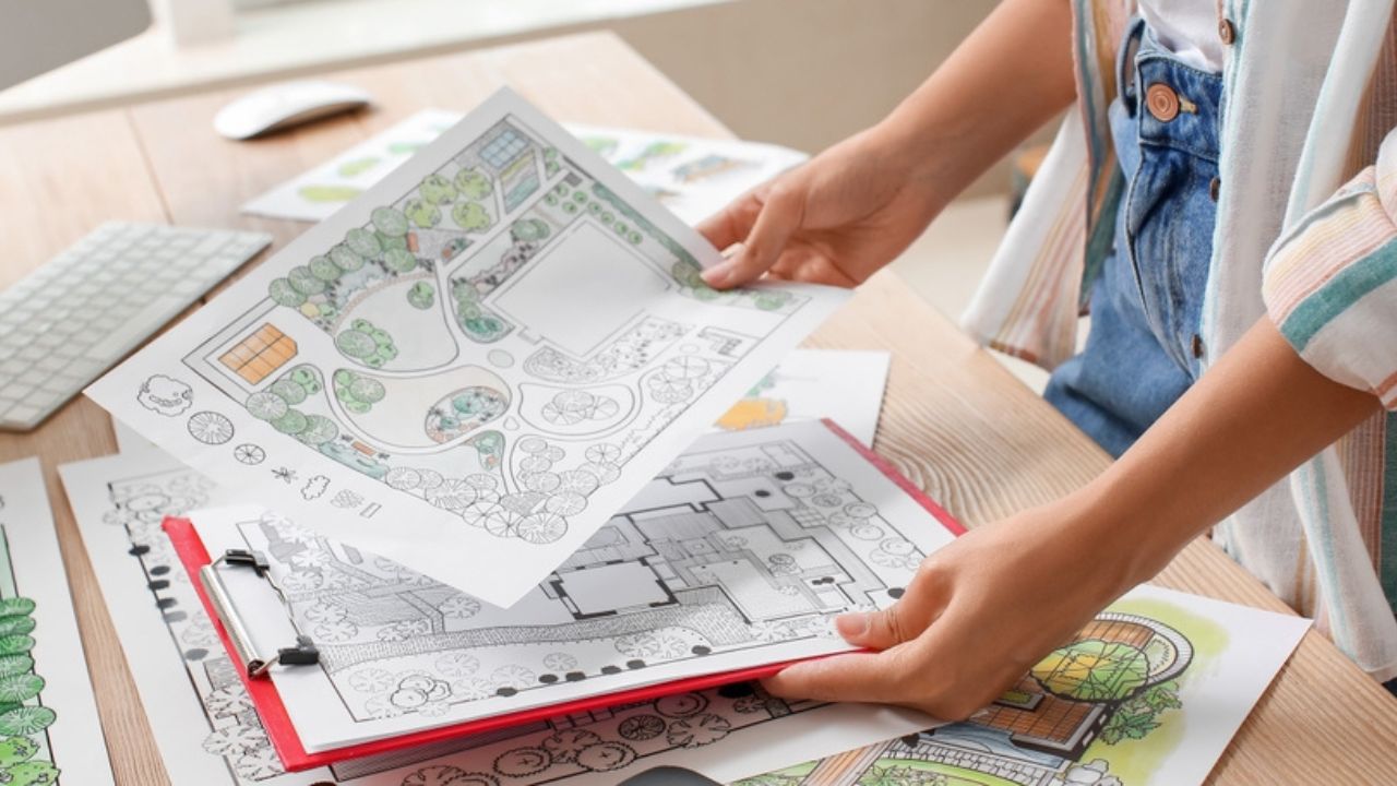 Young female landscape designer working in office, closeup