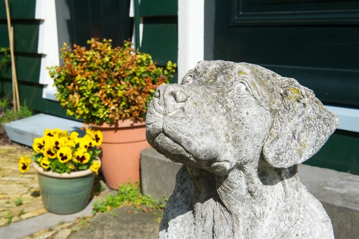 cement dog sculpture