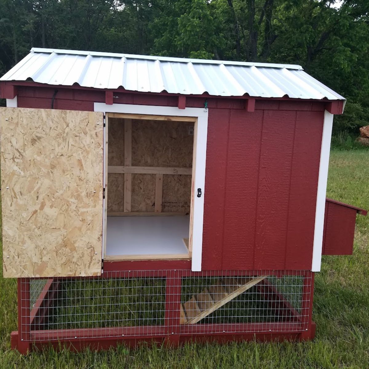 brand new chicken coop: red with white trim