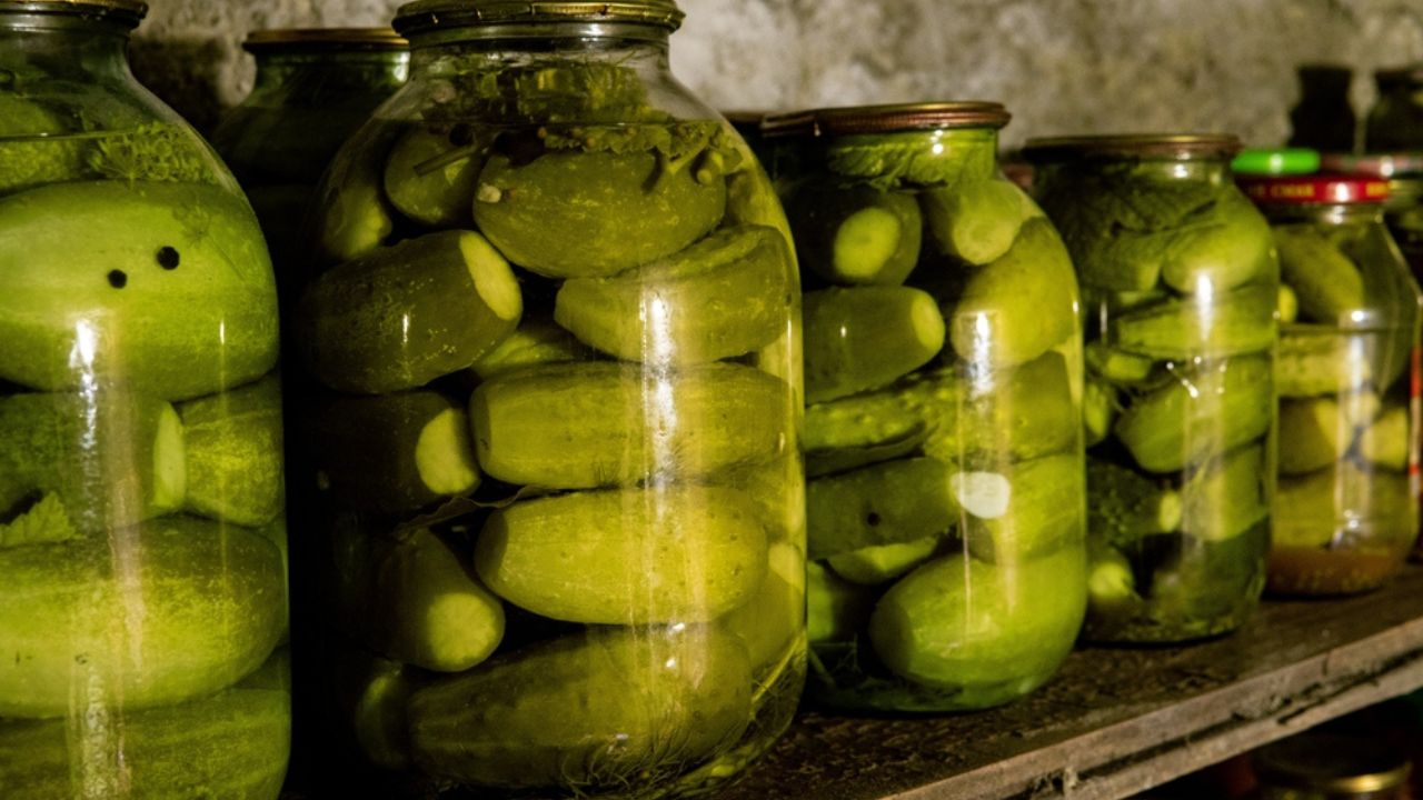 Canned cucumbers, tomatoes in jars, food for the winter, rural food, farming, growing vegetables, storing vegetables, vegetables, canned vegetables, glass jar, jars on shelves Canned cucumbers, tomatoes in jars, food for the winter, rural food, farming, growing vegetables, storing vegetables, vegetables, canned vegetables, glass jar, jars on shelves