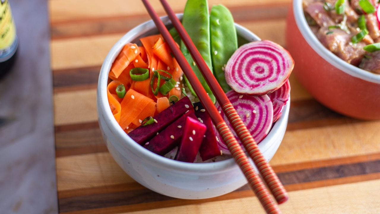 Vegan Poke bowl with beets, carrots, onion, snap peas and rice