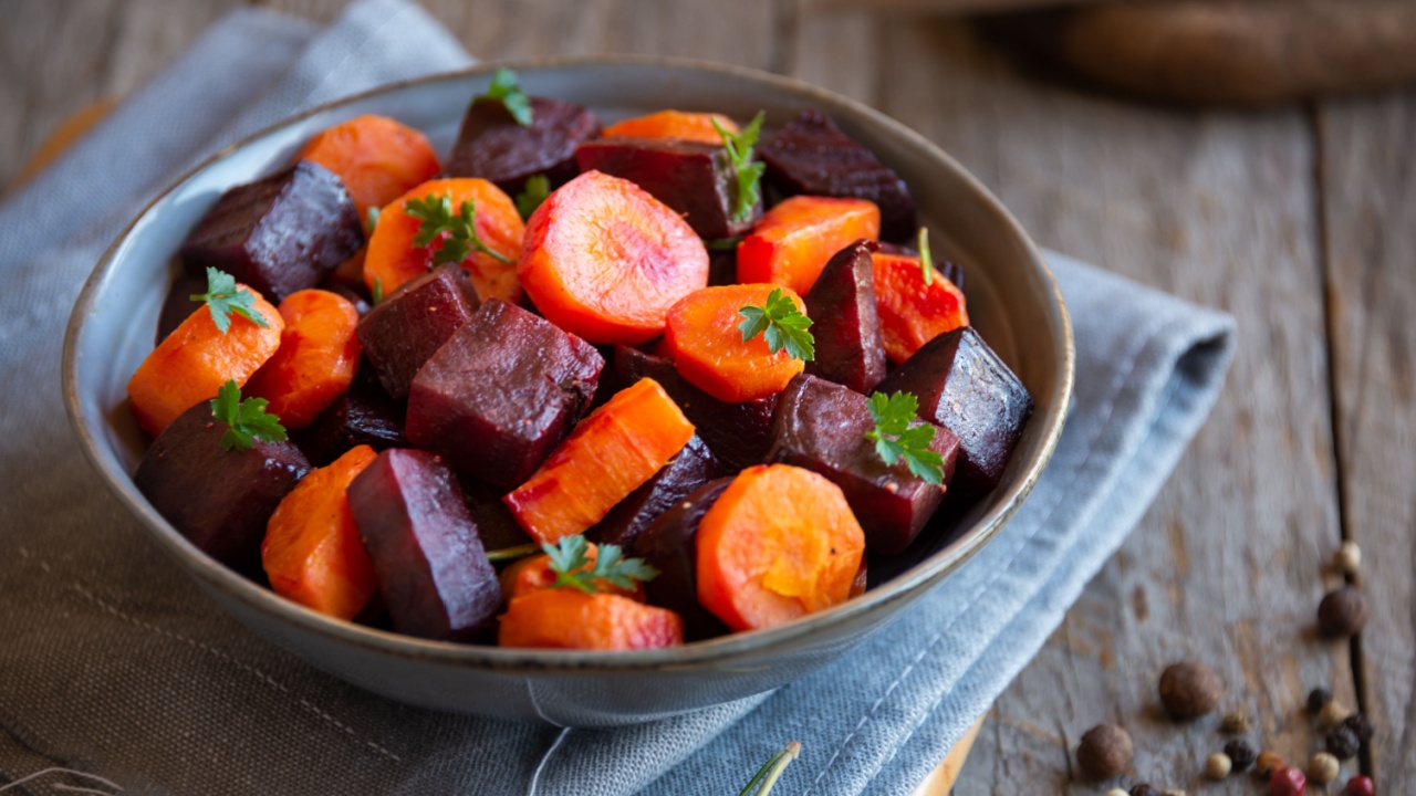 Cooked beets and carrots mix in a bowl, delicious vegetabls dish