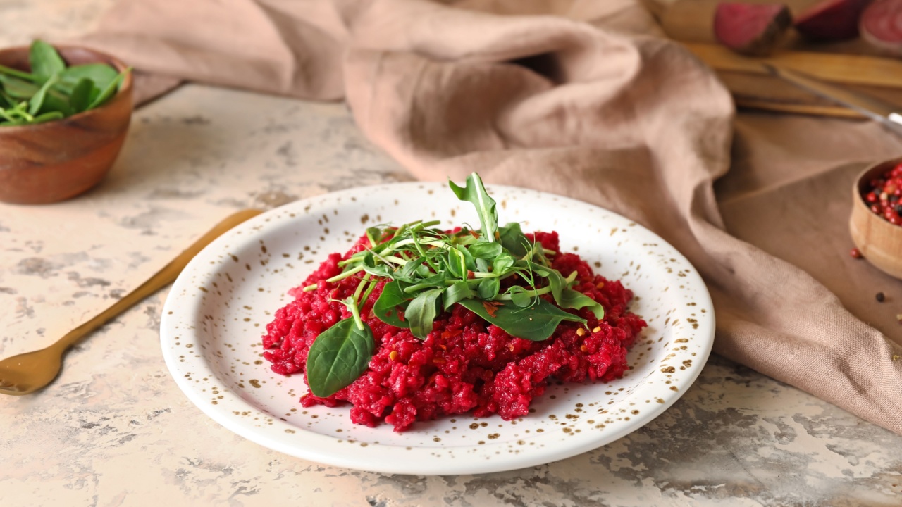 Plate with tasty beet risotto