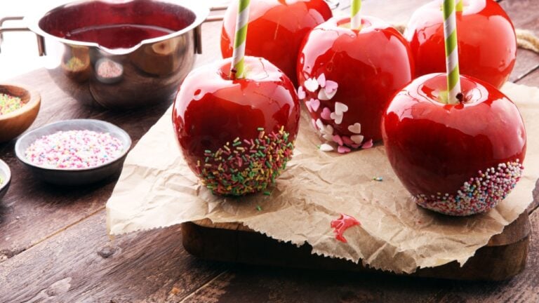 Sugar apple with red icing. Sweets paradise apple on market in Germany. Sweet candy Apple