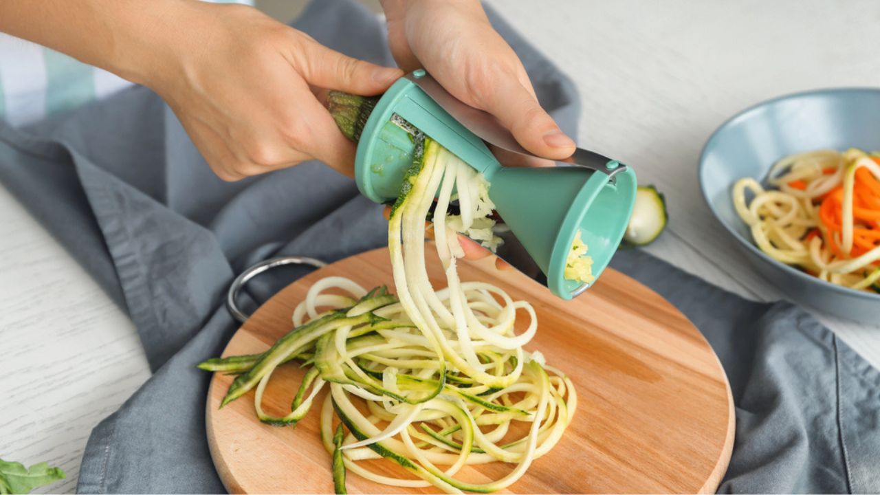 Woman making zucchini spaghetti