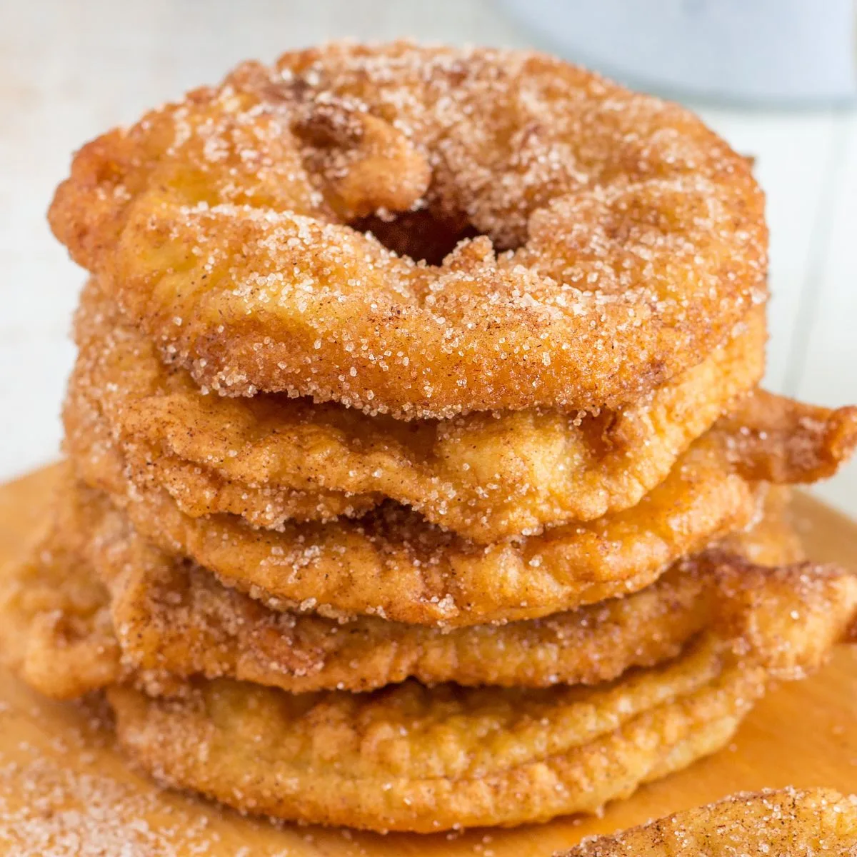 a stack of apple fritters