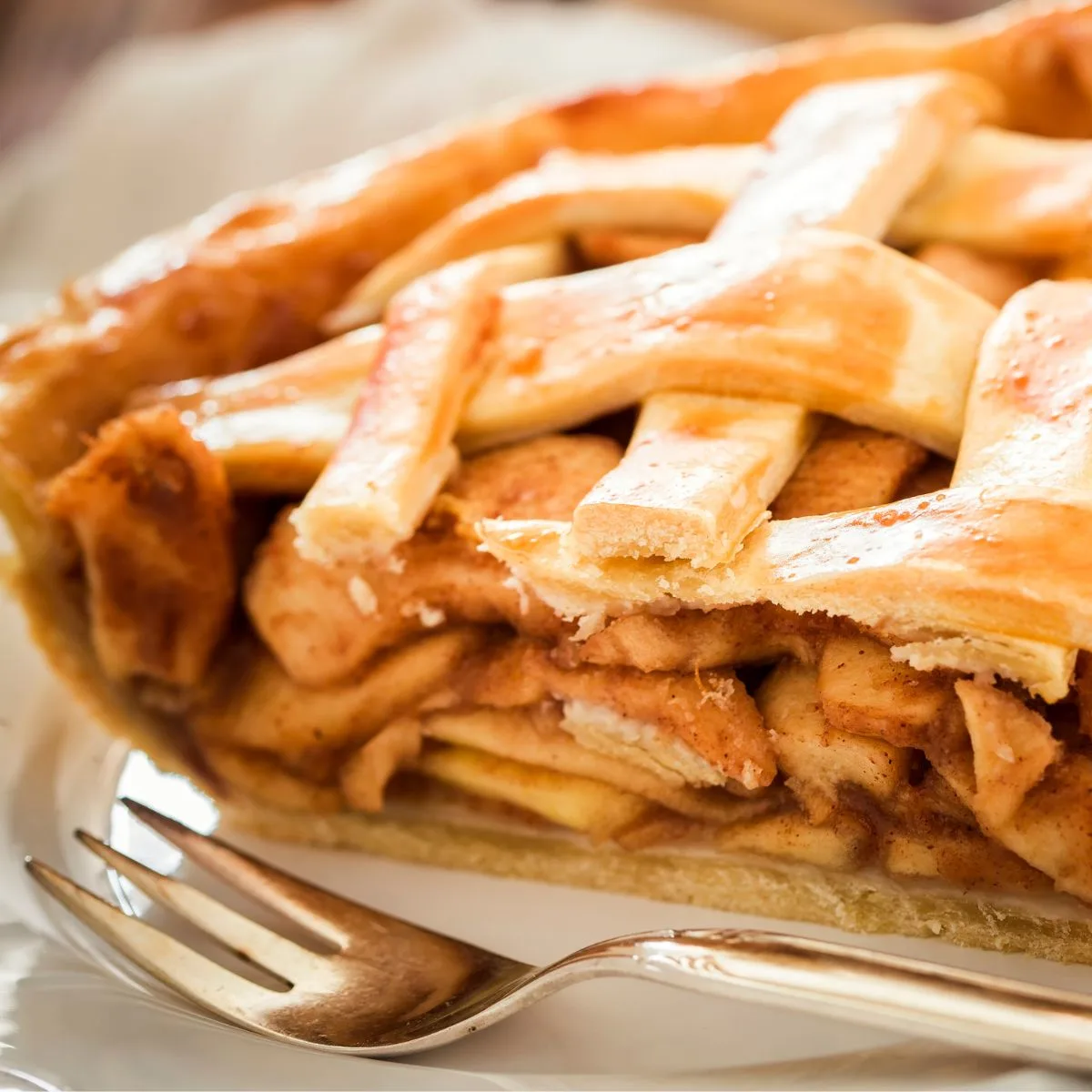 a slice of apple pie with a fork
