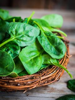 a basket of fresh spinach leaves