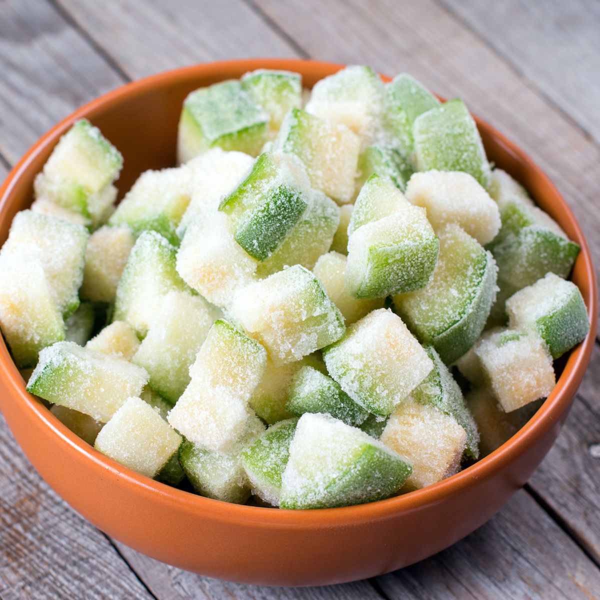 a bowl of cubed frozen zucchini