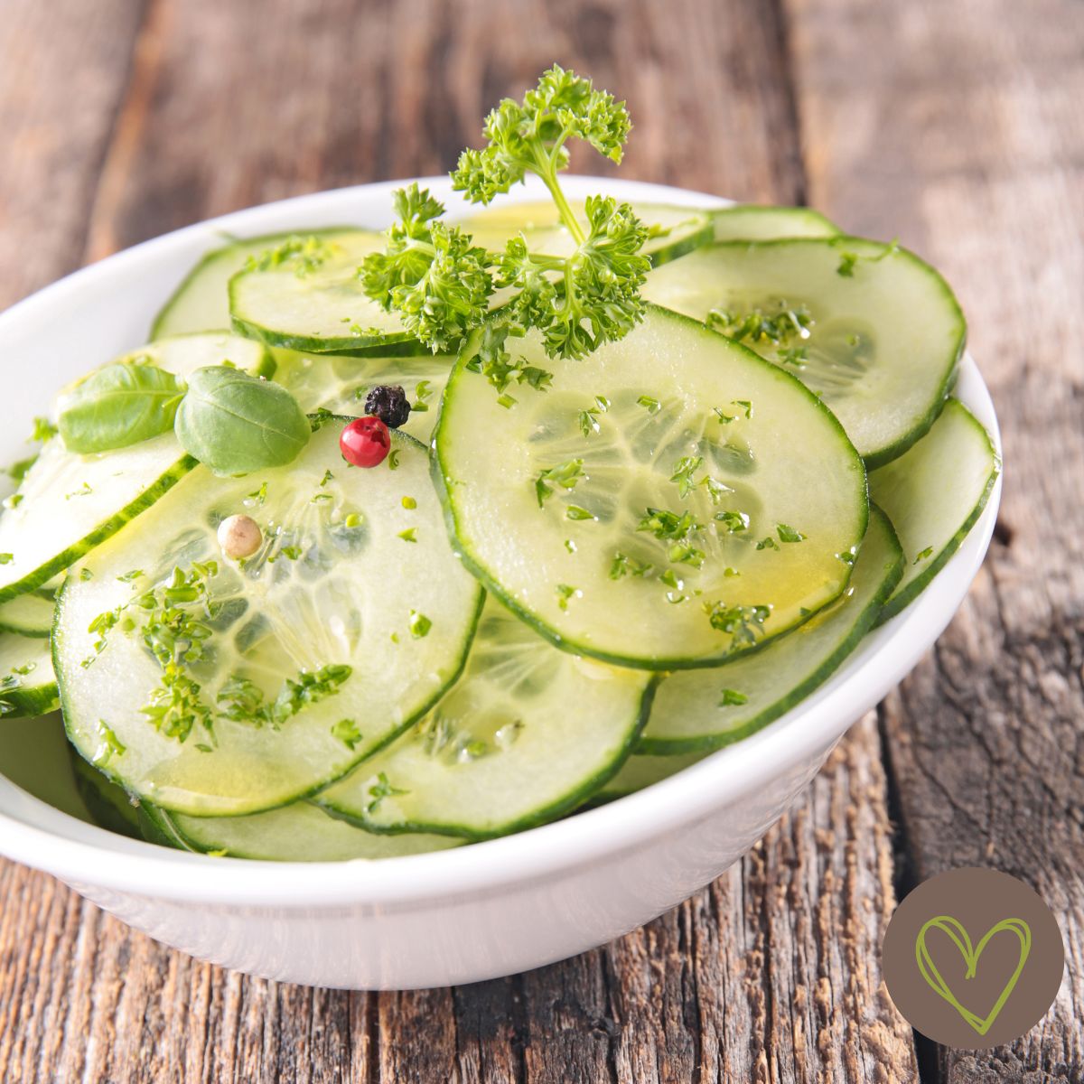 cucumber salad in a white bowl