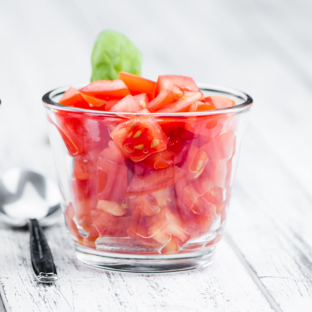diced tomatoes in a glass jar