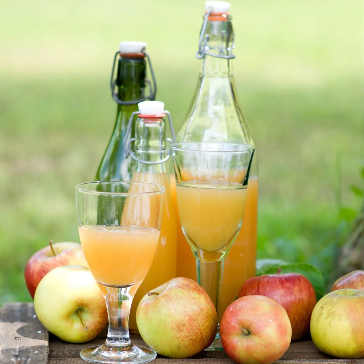 apple juice in glasses and bottles