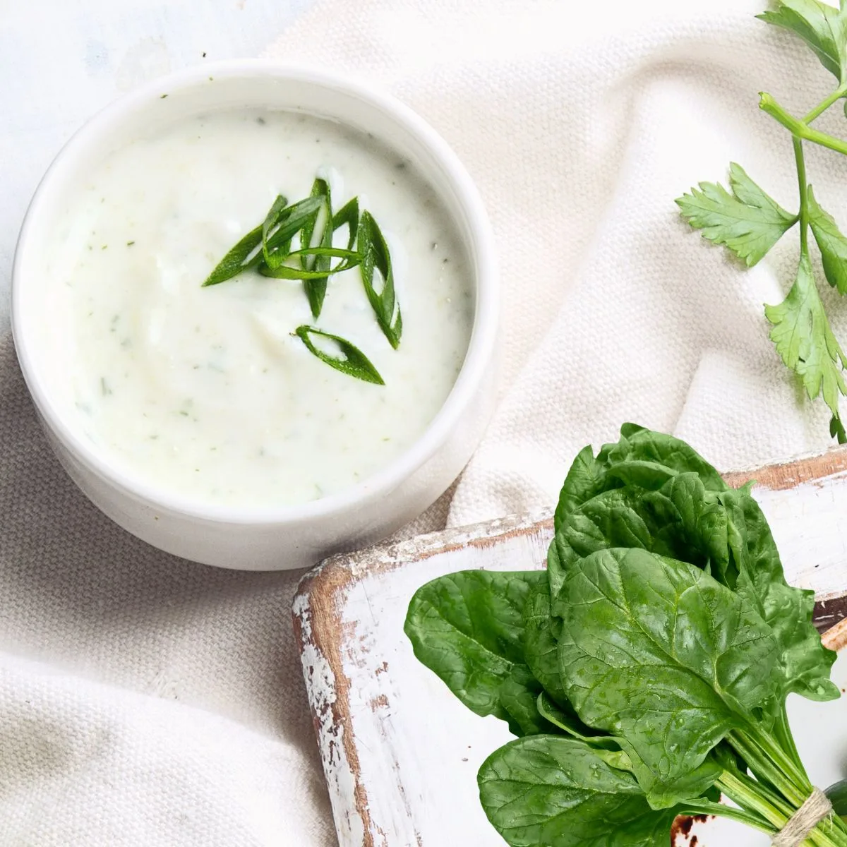spinach dip in a white bowl