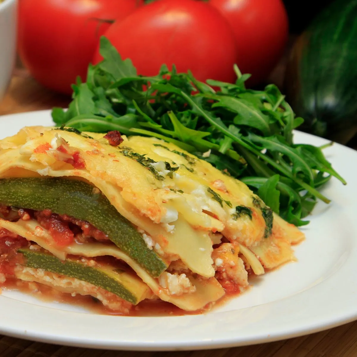 zucchini lasagna with a side of salad greens