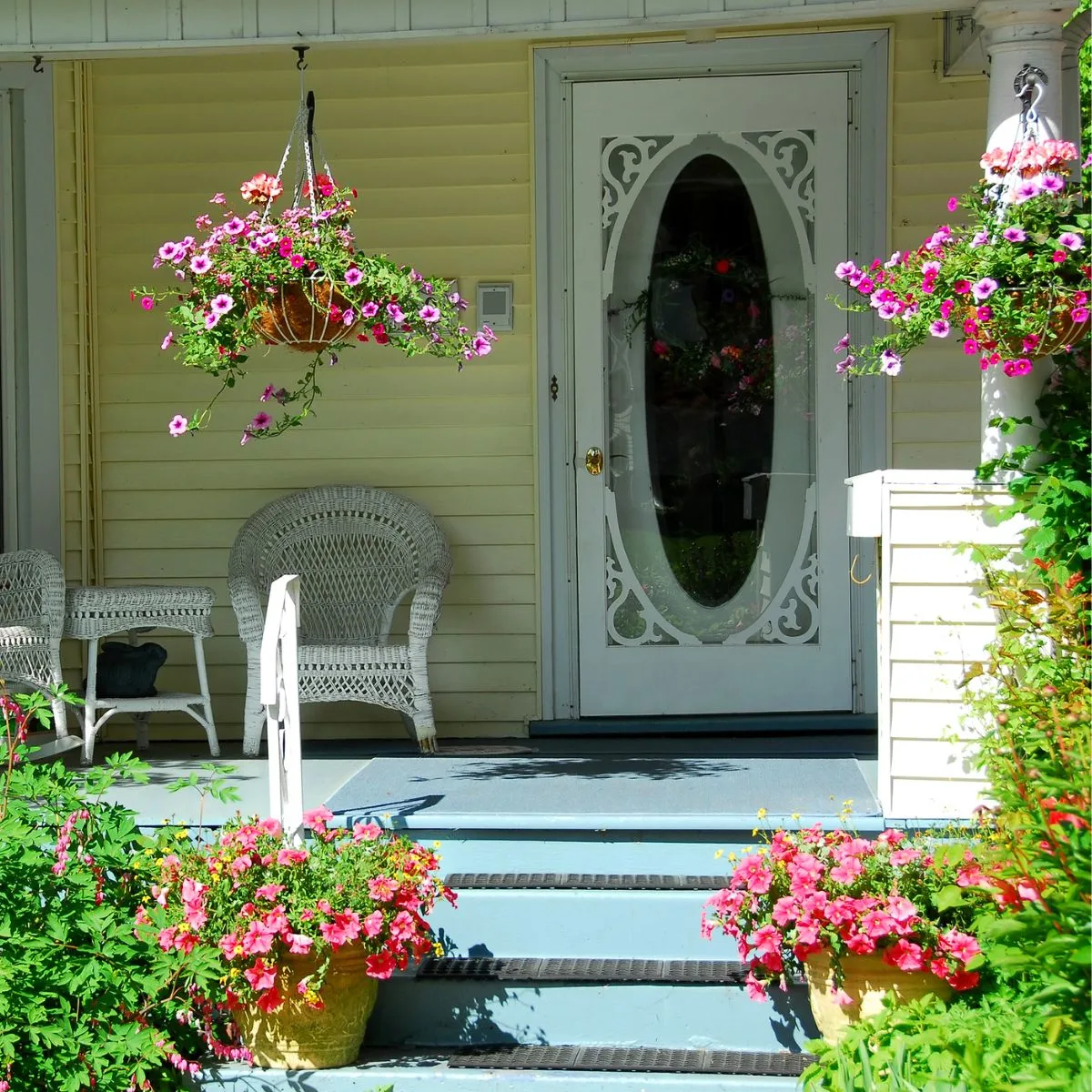 colorful flowers cascading from a pair of hanging baskets. 