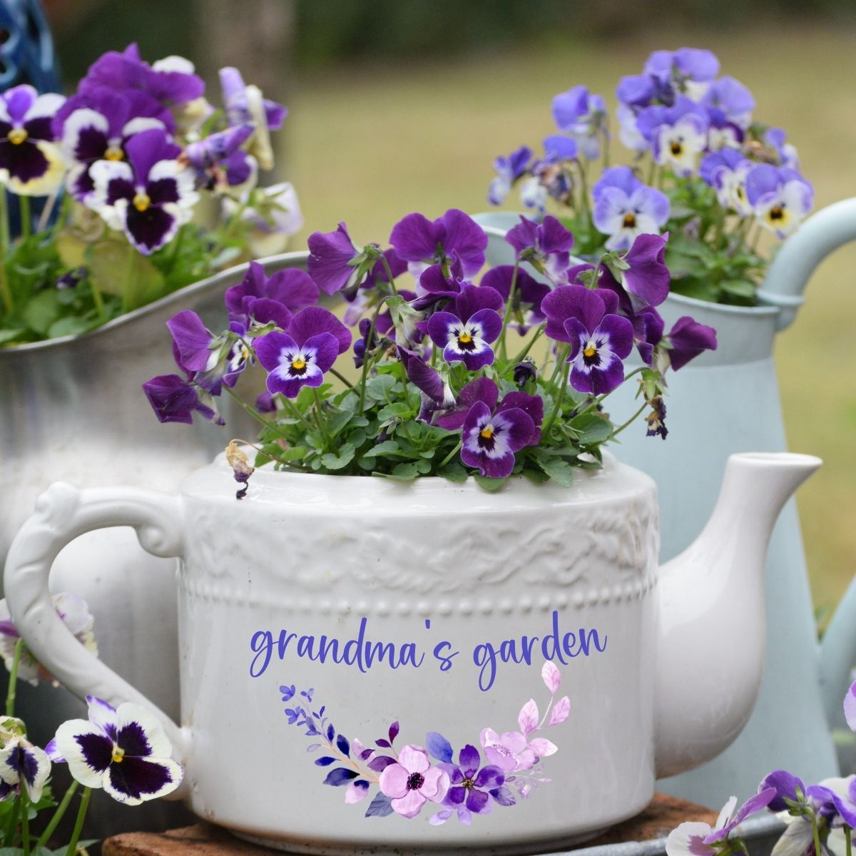Personalized grandma's garden white teapot filled with pansies. 