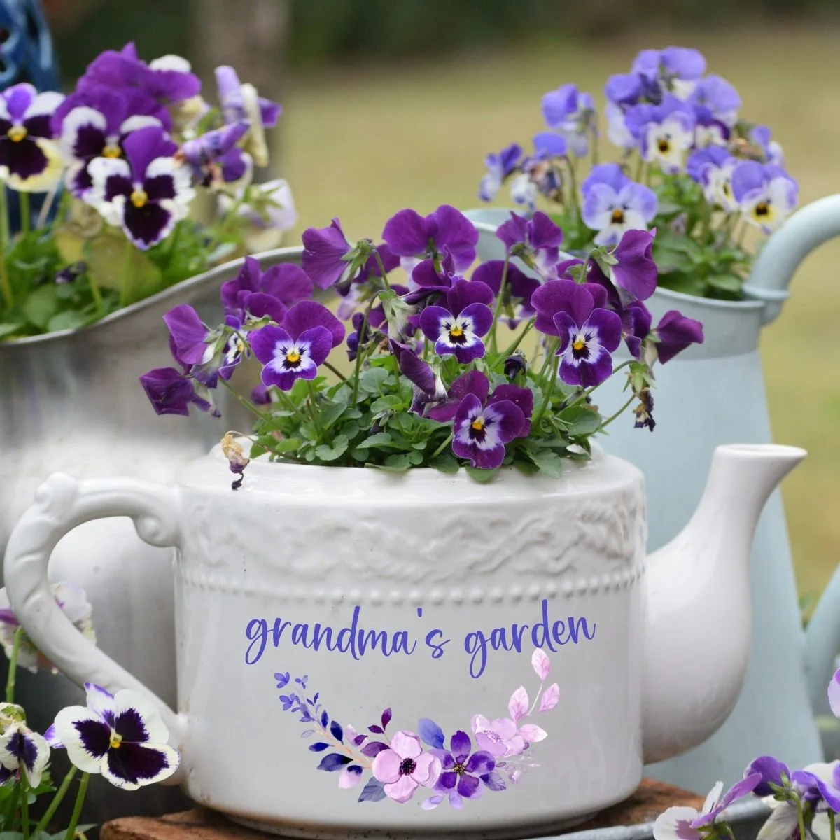 Personalized grandma's garden white teapot filled with pansies. 