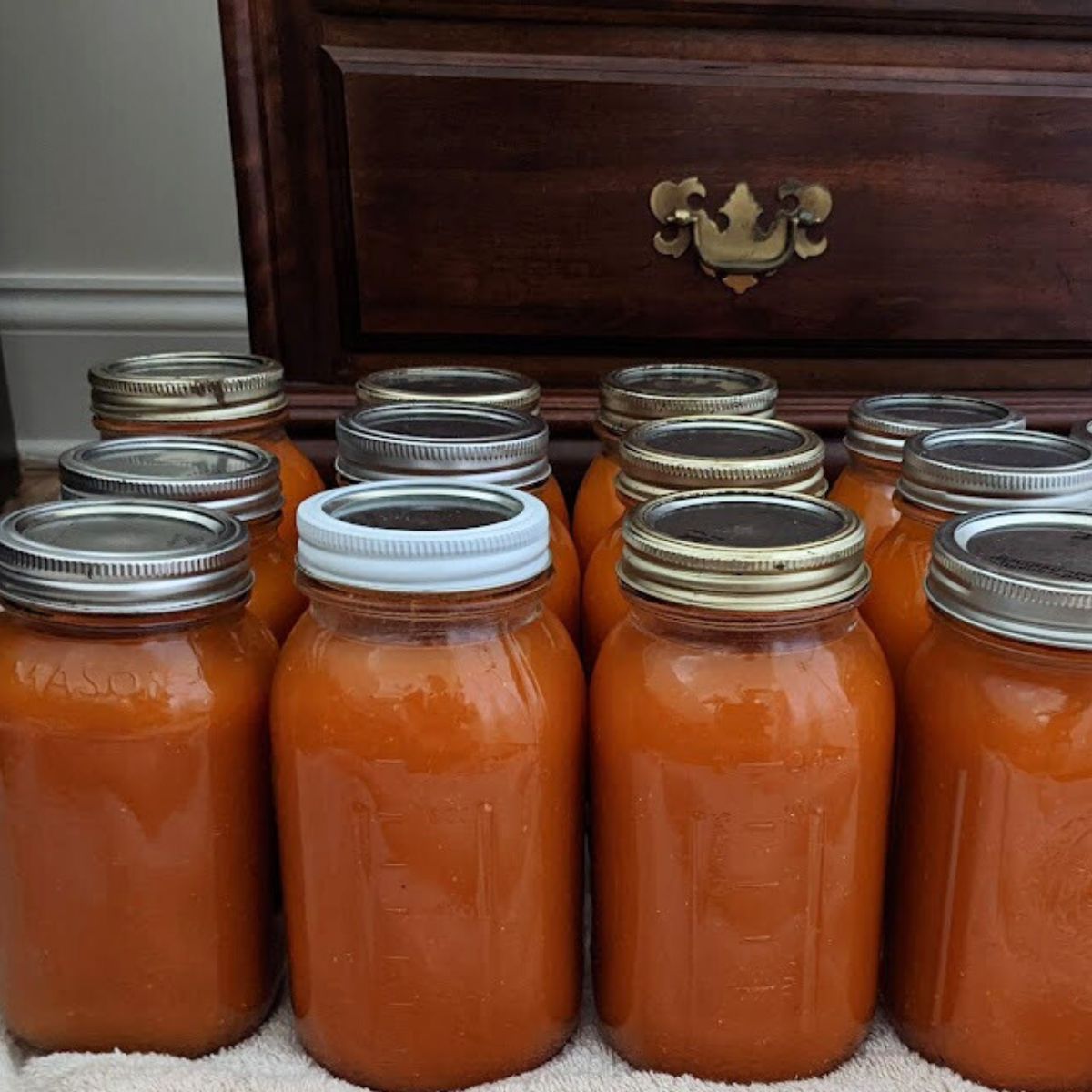 Jars of canned tomato juice.