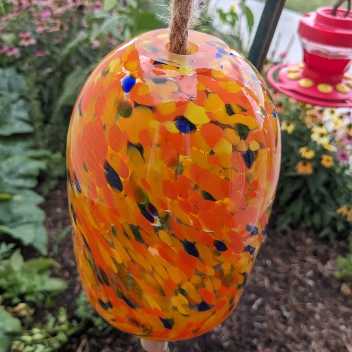 Orange glass wind chime hanging in front of my office. 