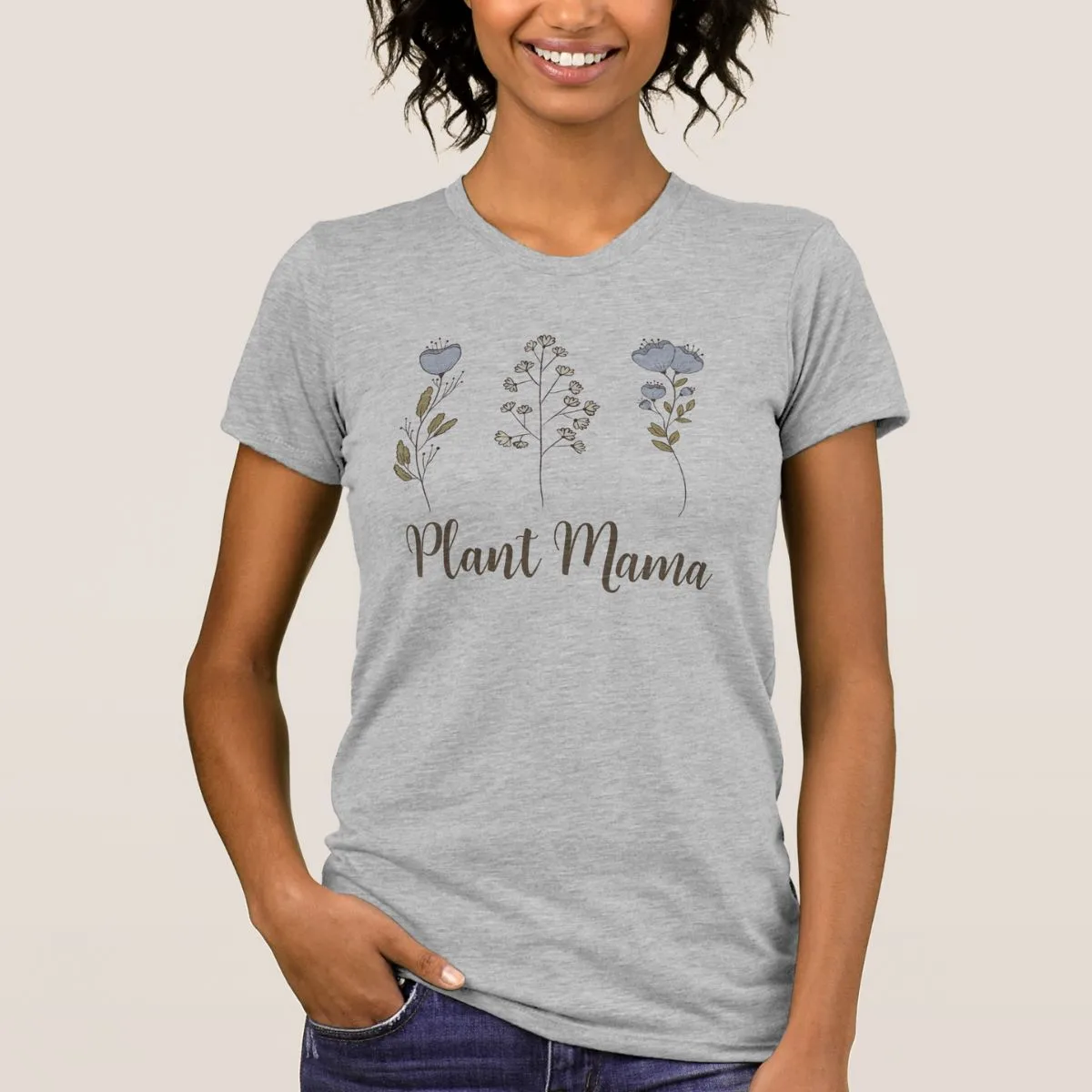 Young woman dressed in a gray t-shirt saying "plant mama".