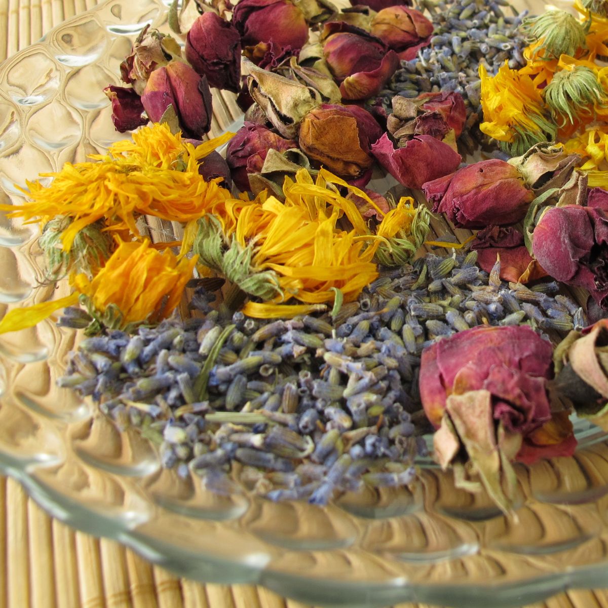 Colorful potpourri made form roses, calendula and lavender buds. 