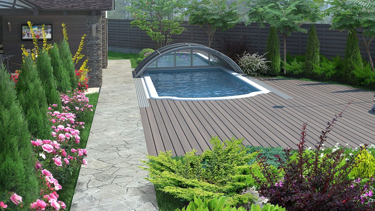 beautiful landscape around pool with arborvitae,pink roses, boxwood and a few other plants. 