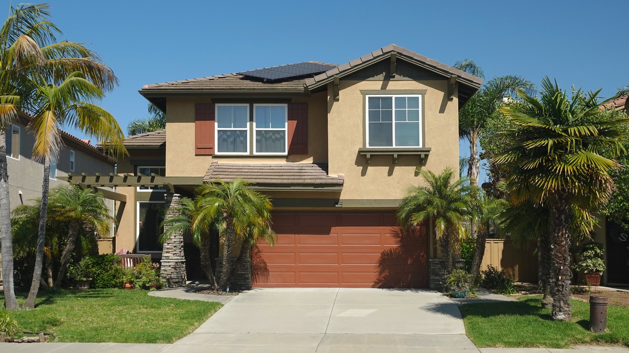 Typical generic suburban single family tract home with built-in garage in California