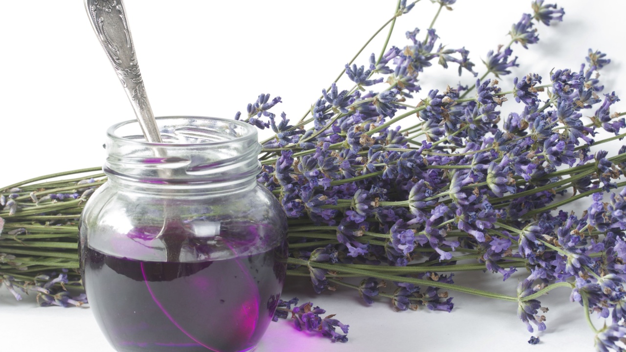 jar of lavender syrup on a white background